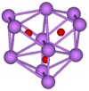  The stick and ball diagram shows three regular octahedra which are connected to the next one by one surface and the last one shares one surface with the first. All three have one edge in common. All eleven vertices are purple spheres representing oxygen, and at the center of each octahedron is a small red sphere representing caesium.