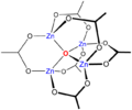 Skeletal chemical formula of a three-dimensional compound, featuring oxygen atom in the center, bonded to four Zn atoms. The latter are interconnected through oxygens and O-C-O groups.