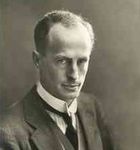  Man, mid-thirties, receding hair, clean shaven, wearing a high collar with tie. He is facing half right but his eyes are on the camera.