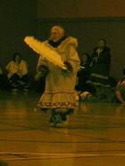 Female dancer in costume performing in front of an audience