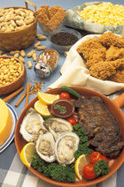 Several plates full of various sereals, fruits and vegetables on a table.