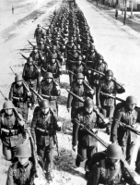 Photo of a column of troops marching