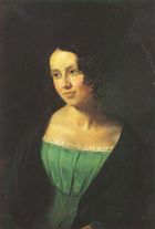 Portrait of a young lady, over a black background. She is wearing a green dress, over a black coat. She is looking to the left, somewhat smiling.