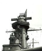 The tower is dominated by a large radar set; two long arms protrude from the side of the tower.