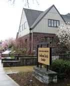 The Walters Cultural Arts Center is a two story building with the first level built of a reddish-purple colored stone.