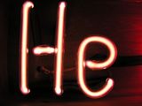 Illuminated light red gas discharge tubes shaped as letters H and e