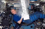 European Space Agency (ESA) astronaut Thomas Reiter, STS-116 mission specialist, works with the Passive Observatories for Experimental Microbial Systems in Micro-G (POEMS) payload in the Minus Eighty Degree Laboratory Freezer for ISS (MELFI) in the Destiny laboratory of the International Space Station while Space Shuttle Discovery was docked with the station. MELFI is a low temperature freezer facility with nominal operating temperatures of -80, -26 and +4 degrees Celsius that will preserve experiment materials over long periods.