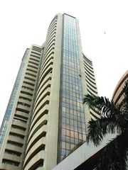 View from ground of a modern 30-story building.