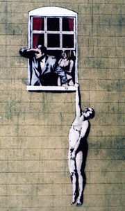 A painting on a building showing a naked man hanging by one hand from a window sill. A man in a suit looks out of the window, shading his eyes with his right hand, behind him stands a woman in her underwear.