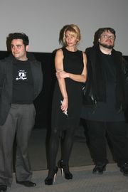 Juan Antonio Bayona, Belén Rueda and Guillermo del Toro dressed in black on a stage from left to right.