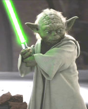 A green creature holding a lightsaber