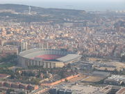 Barcelona stadium seen from above. It is a large and asymmetrically shaped dome.