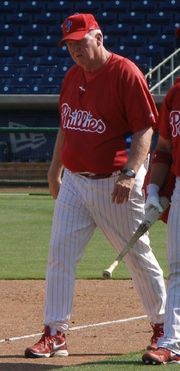 Charlie Manuel walks down the baseline with an unidentified Phillies player