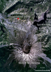 Satellite image of the area surrounding Mount St. Helens, labeled with various locations. The primary locations marked are: Mount St. Helens (in the center of the volcano there is a circular black crater); and to the north of the volcano the Coldwater�II observation post, where Johnston was camped. The other locations marked are three lakes (Spirit Lake, Bear Cove, and Coldwater lake) and a river (North Fork Toutle River).