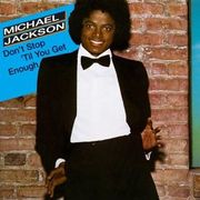 A adult African American male with a black afro. He is making hand gestures with both his hands and is wearing a black bow tie with black and white tuxedo. Behind him there is a brown brick wall and to the side of him there is a blue square with the writing "Michael Jackson" in black and white and "Don't Stop 'Til You Get Enough" in black writing.