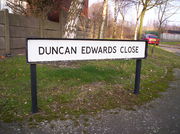 A road sign reading "Duncan Edwards Close"