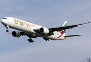 Aircraft landing approach. Front quarter view of twin-engine jet in flight with flaps and landing gear extended.