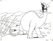 Animated black-and-white image of a large dinosaur atop a cliff, with a man in a suit standing in its mouth. Several rocks can be seen in the background.