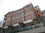 A red brick building viewed from a low angle