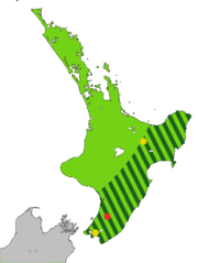 Map of the North Island of New Zealand coloured light green with dark green stripes from the central mountains to the sea along the east coast to Wellington, and one red and two yellow dots.