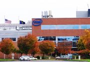 Red brick and metal office and production facility at Intel Corporation's Ronler Acres campus. Building is the main entrance and includes the company's logo on the exterior.