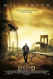 A man wearing leather clothes and holding a rifle walks  alongside a dog on an empty street. A destroyed bridge is seen in the background. Atop the image is "Will Smith" and the tagline "The last man on Earth is not alone". Below is the film's title and credits.