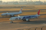 Two twin-engine airliners on parallel taxiways.