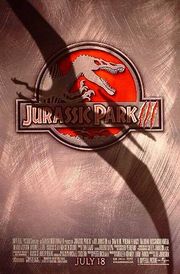 Movie poster with a logo at center of a skeleton of a Spinosaurus, with its mouth agape and hands lifted up. The background of the logo is red, and right below it is the film's title. A shadow covers a large portion of the movie poster in the shape of a flying Pteranodon. At the bottom of the image are the credits and release date.