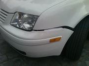 Typical damage to front bumper cover from inadequate ground clearance.