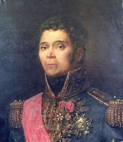 Painted portrait of Kellermann while wearing his French blue general uniform with yellow epaulettes, a red sash, and high collar. His hair and eyes are brown and he gazes to the left of the viewer. Kellermann wears three decorations on his chest.