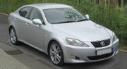 Front quarter view of a compact sedan parked on a street.