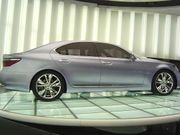 Side profile of sedan on glass turntable.