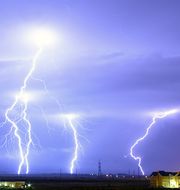 Four bolts of lightning strike the ground