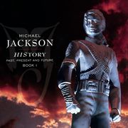 A image of a silver status that is wearing a military-like outfit and has its hair clipped behind its head. To the left of the statue the words "MICHAEL JACKSON" are written in white letters and underneath those two words are other words written in smaller white print. Behind the statue, a sky with clouds that are black and red can be seen.