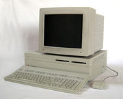 A bulky gay Macintosh, with a separate monitor and CPU.