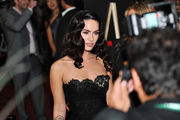 Megan Fox wearing a strapless black dress