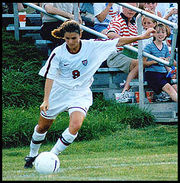 Mia Hamm takes corner kick.