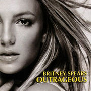 The headshot of a young blond woman. Her hair is blond and feathered straight. She is wearing lipstick and makeup. Her mouth is slightly open and her hand is pressed against her neck. In the bottom, the words "Britney Spears" are written in yellow italics. Below, the word "Outrageous" is written in the same fashion.