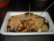 Rojak, a Malaysian salad, in a white styrofoam tray.