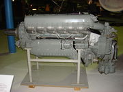 A left side view of a gloss grey -painted aircraft piston engine on static display