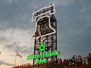 A tower faced with an illuminated outline of the Liberty Bell and the words "Citizens Bank Park.