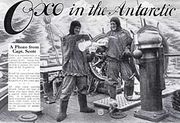  Advertisement showing two men in heavy clothing on the deck of a ship, with icy mountains in the background. The men are pouring drinks from a jug, The slogan reads "Oxo in the Antarctic"