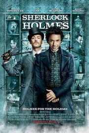 Robert Downey, Jr. and Jude Law, in-character. The background is a window display, featuring shelves containing miscellaneous objects relating to the story. The poster reads "Sherlock Holmes" across the top, with the tagline "Holmes for the holiday" centered at the bottom. The poster is predominately turquoise coloured.