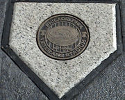 A concrete pentagonal marker in the parking lot