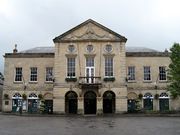 Symmetrical two storey building in classical style with nine bays.