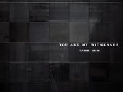 Black wall, with the quote "You are my witness" etched in black off-center.