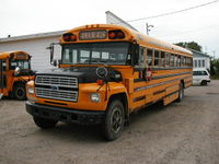 A Canadian Blue Bird school bus with Ecoliers ("Schoolchildren") legend