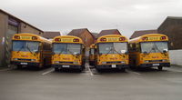 Right-hand drive Blue Bird TC/3000 RE (aka All American RE) school buses in the United Kingdom; these are units imported from the United States.