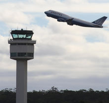 Melbourne airport control tower and united B747.jpg