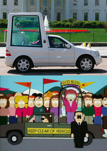 Two images are shown next to each other for comparison purposes. The top images if a modified gray truck with a large dome attached to the back, with a man dressed all in white visible sitting inside. The bottom image is a crudely-animated cartoon image of similarly modified brown truck with a woman standing and waving inside the dome. A man wearing a black suit and sunglasses stands in front of the truck, and a large crowd of onlookers stand behind it.